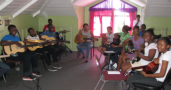 Teaching music to orphanage children